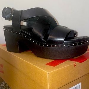 Women’s black strap leather clogs